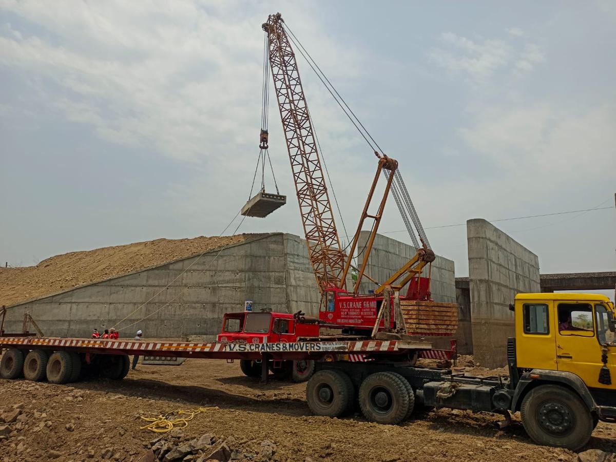Crane placing PSC slab